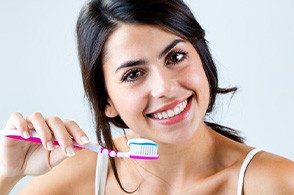 closeup of person brushing teeth