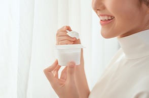 woman eating yogurt