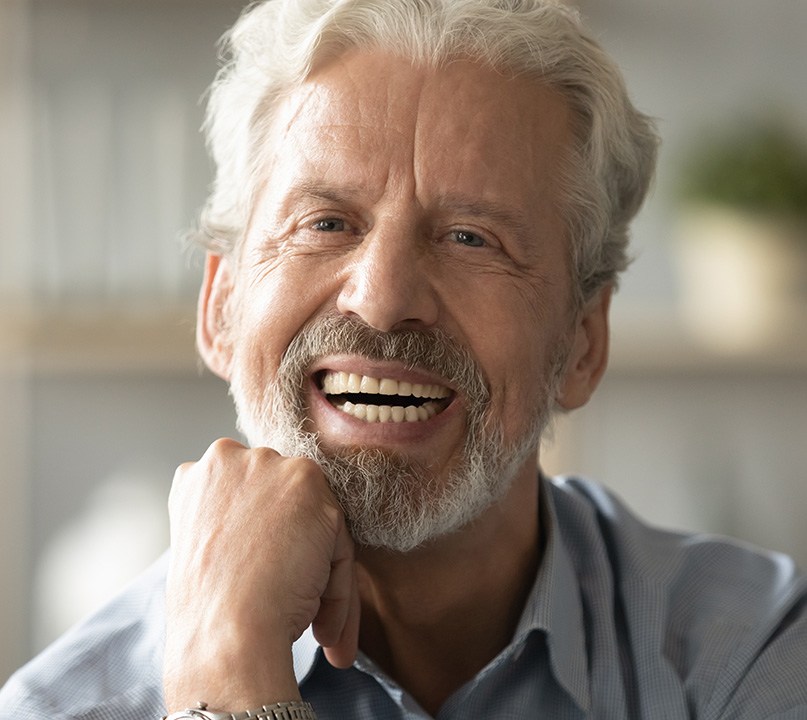 closeup of man smiling after getting all on 4 