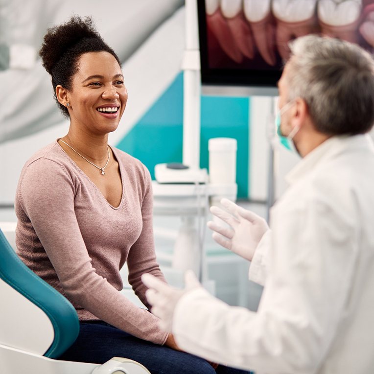 Patient smiling at dentist during checkup