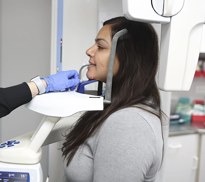 Woman receiving scans of her mouth and jaw using advanced dental technology