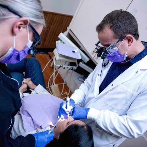 Doctor Young giving a patient a dental checkup