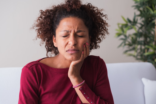 patient experiencing tooth sensitivity